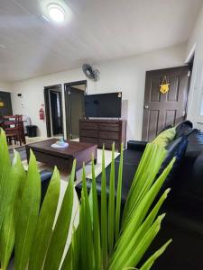 a living room with a couch and a table at The City Edge in Vatuwangga +36 photos