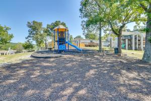 a playground with a slide in a park at 1 Mi to Silver Dollar City! Lake-View Family Haven in Branson