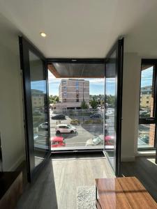 an empty room with a view of a parking lot at Luxury central York Apartment in York
