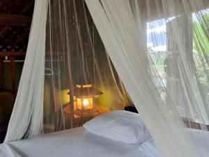 Postel nebo postele na pokoji v ubytování Kham Ecolodge