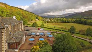 an aerial view of a building with tables and chairs at Embleton Spa Hotel & Apartments in Embleton