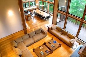 an overhead view of a living room with a couch and a table at Chalet Tacito Niseko Luxury Stay in Niseko