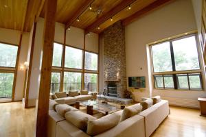 a large living room with couches and a fireplace at Chalet Tacito Niseko Luxury Stay in Niseko