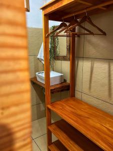 a bathroom with a sink and a mirror at Casinhas da Serena in Caraíva +25 photos