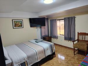 Postel nebo postele na pokoji v ubytování Conquistador Hotel