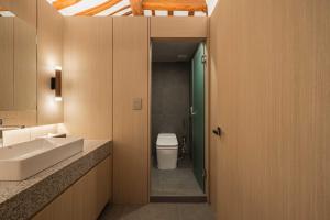 a bathroom with a sink and a toilet at Luxury Hanok Moonlight Hill in Seoul +3 photos