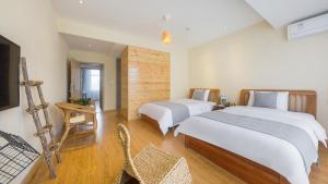 Postel nebo postele na pokoji v ubytování Dashe Yuanye Boutique Homestay