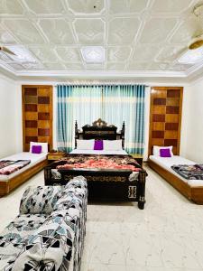 Кровать или кровати в номере Comfort Rezidor Guest House