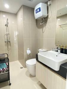 a bathroom with a toilet and a sink and a shower at 2 bedroom luxury apartment nongsa golf At The nove Nuvasa Bay in Nongsa