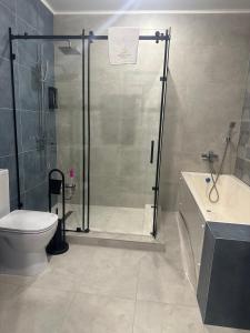 Koupelna v ubytování Grand Way Hotel