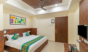 A television and/or entertainment centre at Treebo Rakshitha, Porur