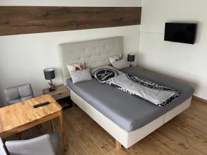 En eller flere senge i et værelse på Das Nistkästchen