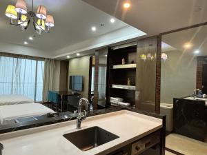 Postel nebo postele na pokoji v ubytování Guangzhou City Inn Hotel Apartment Pazhou
