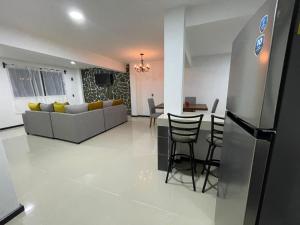 a living room with a couch and a table at Hospedaje Chignahuapan in Chignahuapan