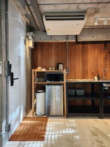a kitchen with a sink and a stove at hiddenwoods in Bang Chak