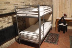 Letto o letti in una camera di Alba Hostel