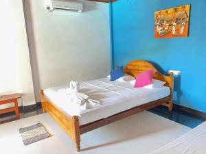 Postel nebo postele na pokoji v ubytování Hotel Sanda Diya - Dambulla