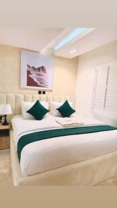 Krevet ili kreveti u jedinici u okviru objekta Tranquil Oasis Hotel