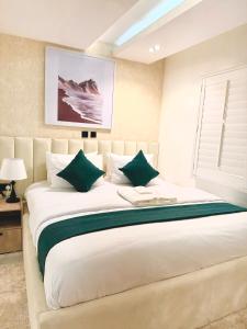 Krevet ili kreveti u jedinici u okviru objekta Tranquil Oasis Hotel