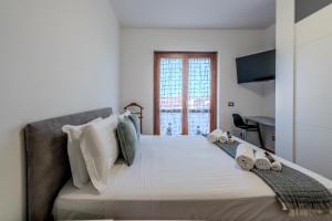 Giường trong phòng chung tại Luxury Apartment in Olbia, Terrazza & Cinema