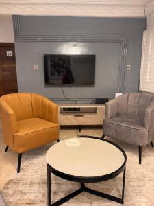 TV i/ili multimedijalni sistem u objektu Tranquil Oasis Hotel