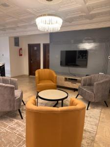 TV i/ili multimedijalni sistem u objektu Tranquil Oasis Hotel