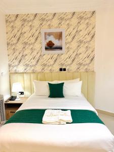 Krevet ili kreveti u jedinici u okviru objekta Tranquil Oasis Hotel