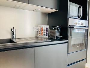 a kitchen with a sink and a counter top at Vitamine Sea in Ploemeur