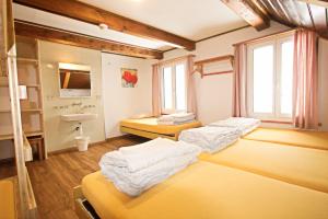 Letto o letti in una camera di juhui Flumserberg