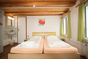 Letto o letti in una camera di juhui Flumserberg