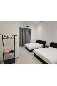 Ένα ή περισσότερα κρεβάτια σε δωμάτιο στο J Garden Village