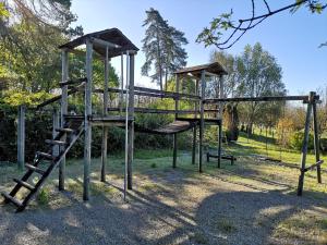 an empty playground with a slide and a ladder at La belle étoile in Reygade