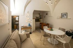 a living room with a couch and a table at I ricami di Annina in Castellana Grotte