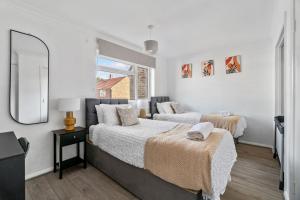 Ένα ή περισσότερα κρεβάτια σε δωμάτιο στο Luxury 3 bedroom house in Ashford with WiFi and Free parking