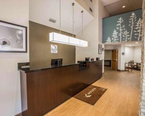 a lobby of a hotel with a reception desk at Sleep Inn Greensboro Airport in Greensboro