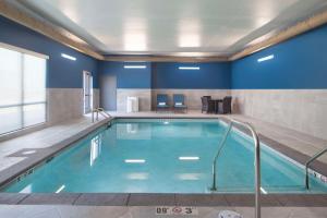 a pool in a hotel room with blue walls at Hampton Inn Ogallala in Ogallala