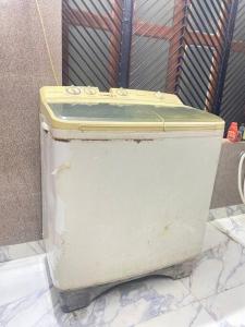 an old white toilet sitting on the ground at Abhiraj stay in Ayodhya +8 photos