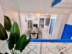 a dining room and living room with a table and chairs at Comfort Home Patong in Patong Beach +25 photos