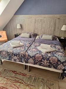 Postel nebo postele na pokoji v ubytování Filsdeger Ház - Central Rooms & Apartmans