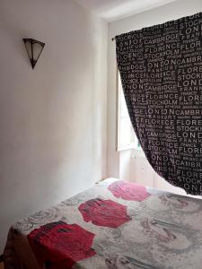 Ένα ή περισσότερα κρεβάτια σε δωμάτιο στο Rosso rubino