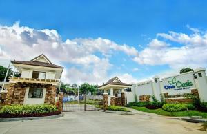 a building with a one quest sign on it at One Oasis Cagayan De Oro 2-Bedroom Unit in Cagayan de Oro