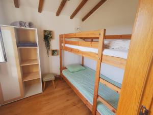 a bedroom with two bunk beds in a room at Quinta Vida Verde in Alvaiázere +46 photos