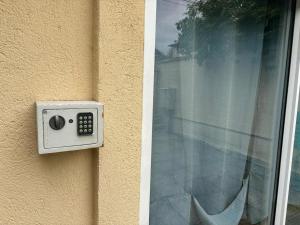 a remote control on the side of a window at Studio T2 proche Jardin de Plantes Rouen in Rouen