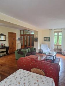 a living room with two couches and a piano at Lake View Camelia Room at Villa Isabella Stresa Retreat Ages 6 plus in Stresa