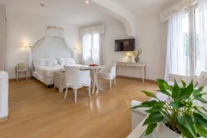 TV a/nebo společenská místnost v ubytování Hotel Al Cavallino Bianco