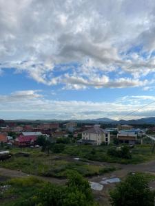 a view of a town under a cloudy sky at Трёхкомнатная квартира в центре Борового in Borovoye