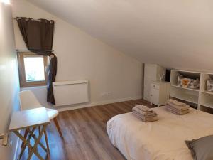 En eller flere senge i et værelse på Maison 120 m2 à Gerardmer proche centre ville