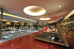 a gym with cardio equipment in a building at Suites SCSP Residence in Sembulan