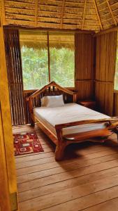 En eller flere senge i et værelse på Castaña Amazon Park