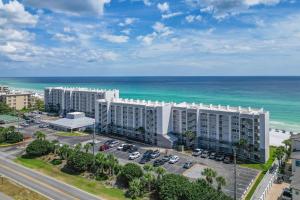 an aerial view of a building near the ocean at Beach House 301D - Southern Magnolia in Destin